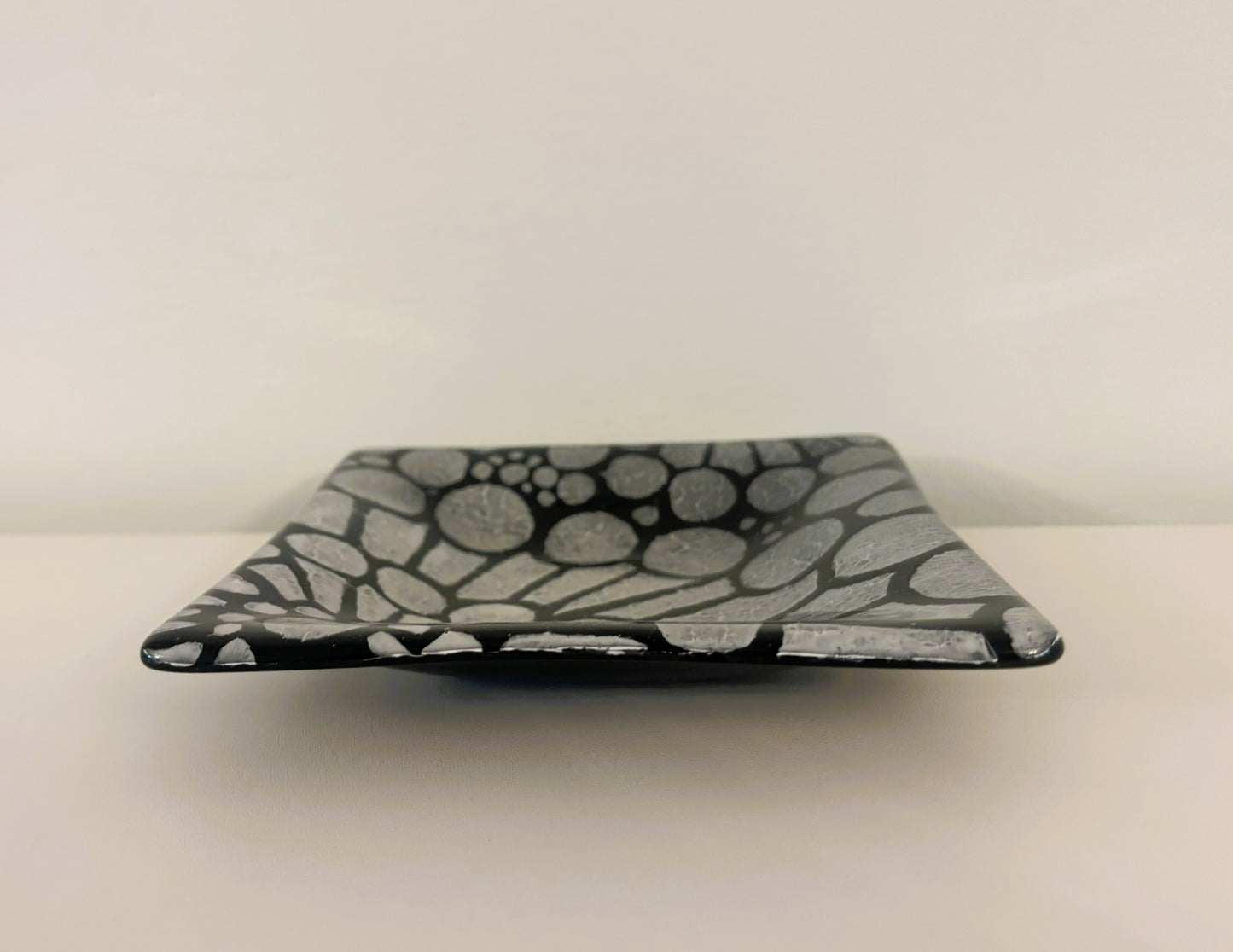 Pair of black and white dishes