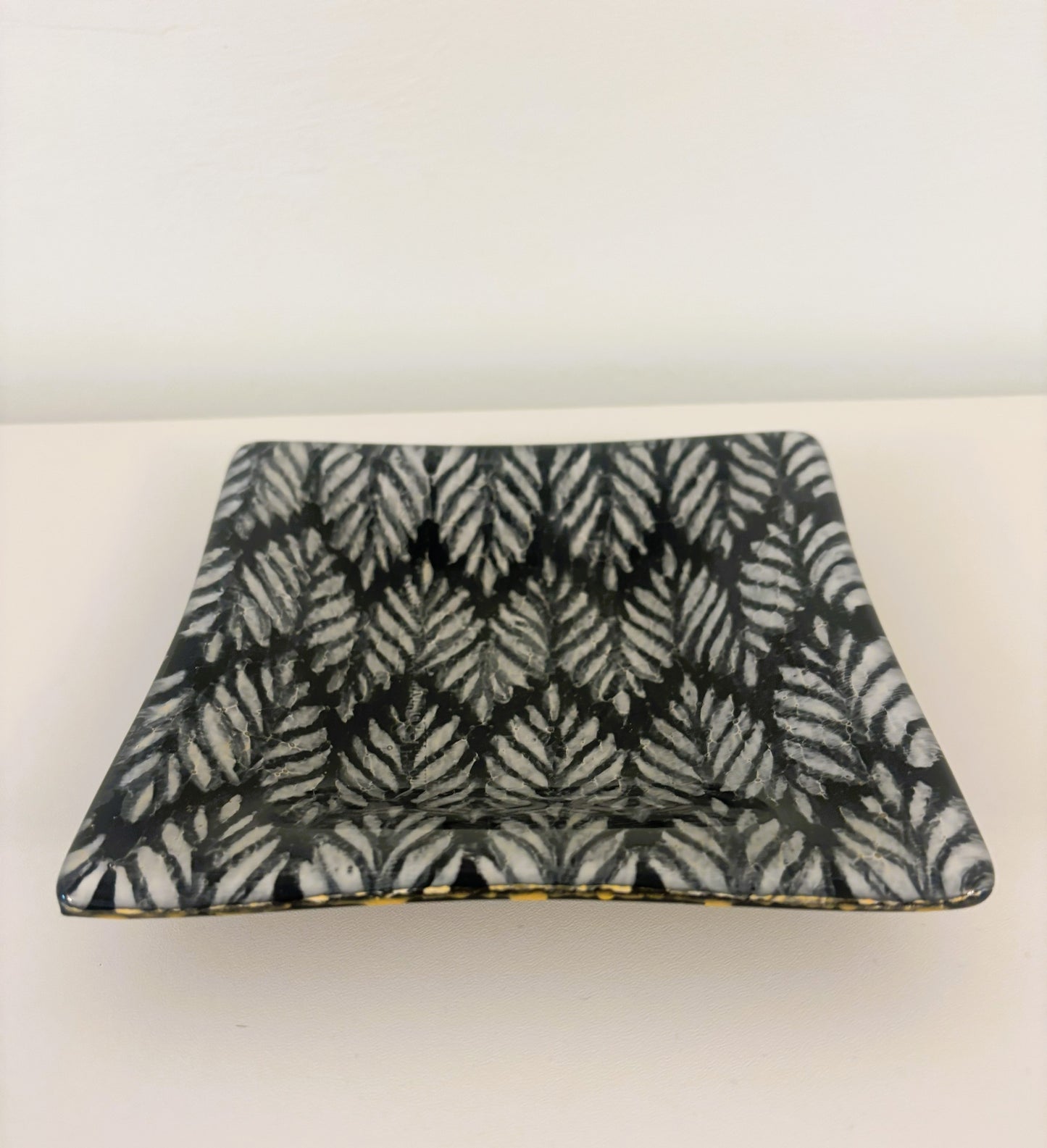 Pair of black and white dishes