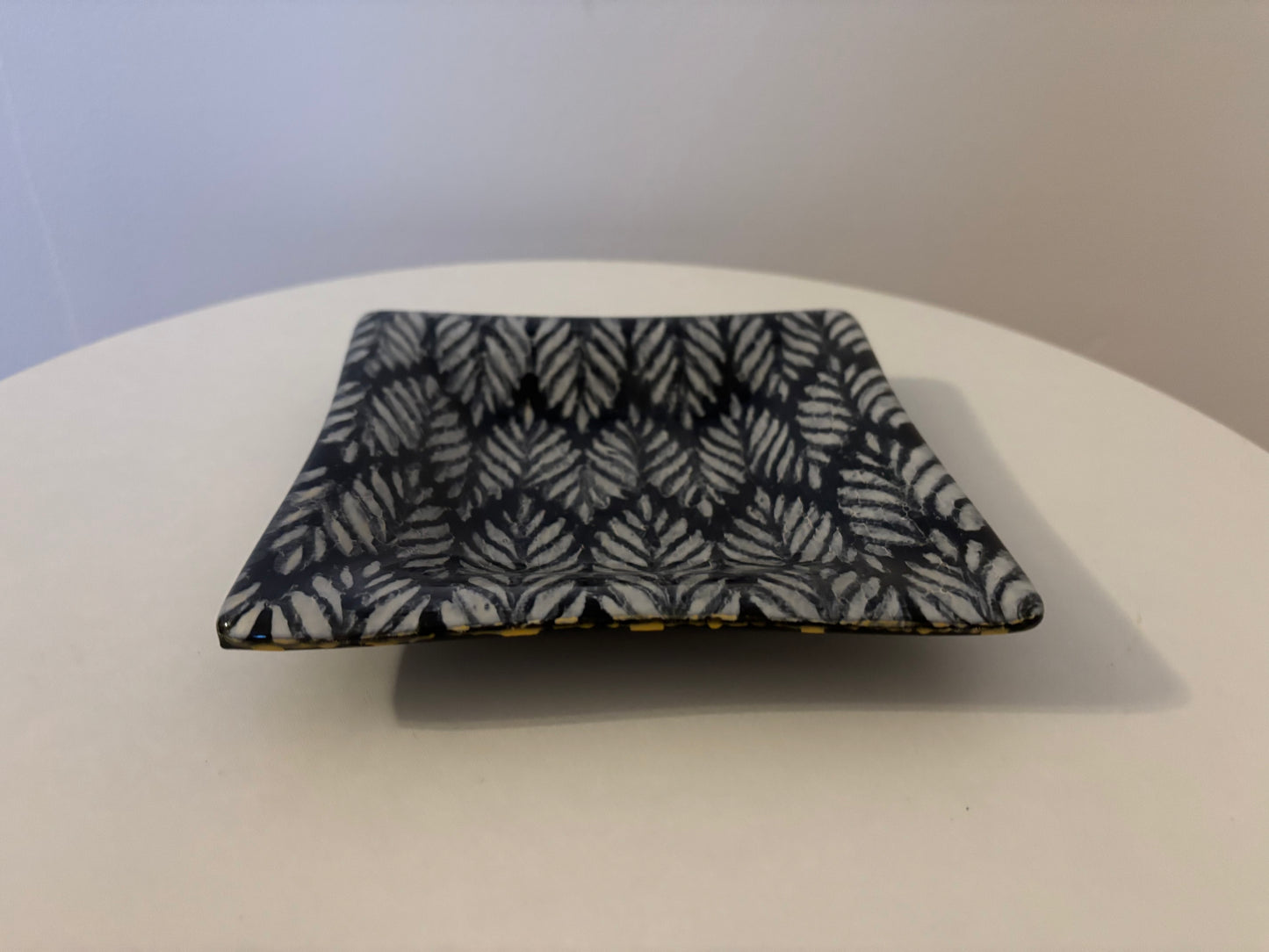 Pair of black and white dishes