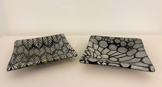 Pair of black and white dishes