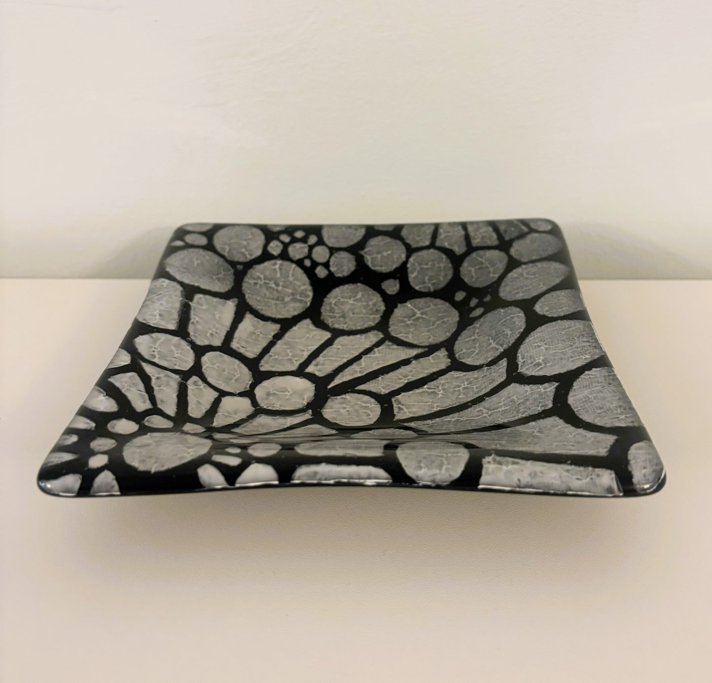 Pair of black and white dishes