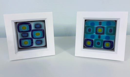 Small framed blue tiles
